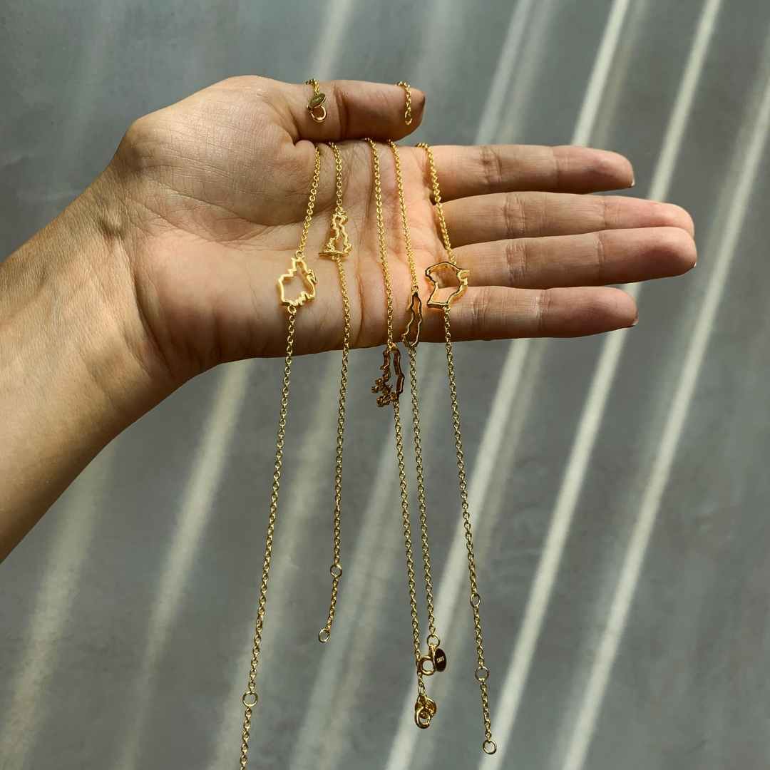 The Place map bracelets in gold