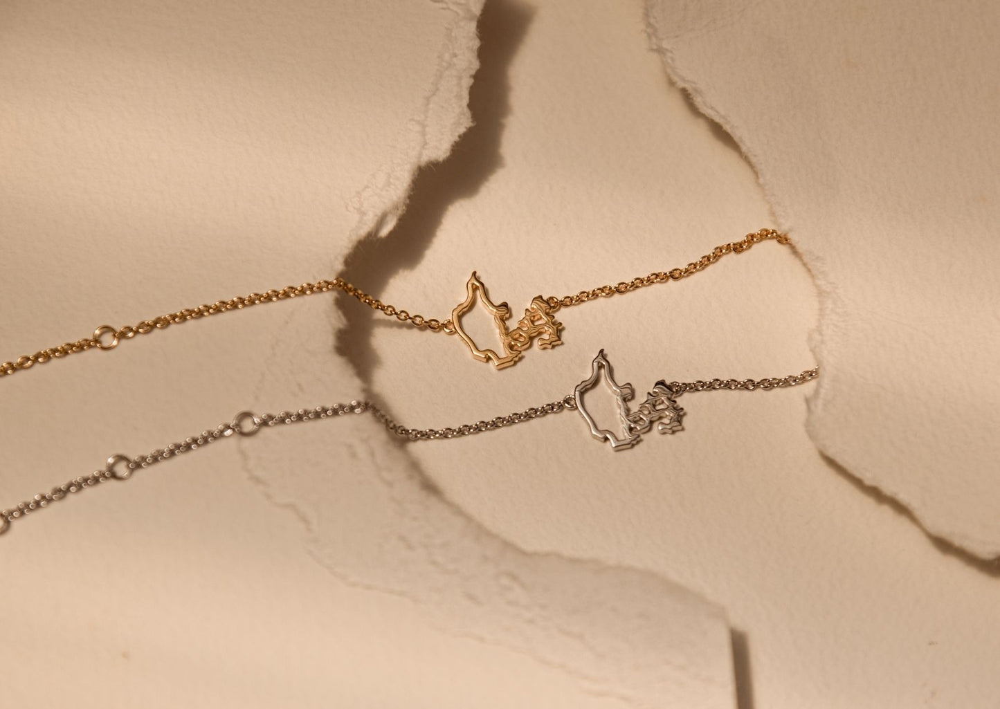 Denmark map bracelets in silver and gold