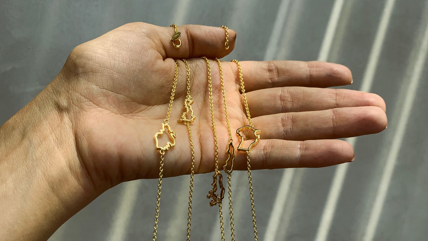 Map bracelets in gold from The Place